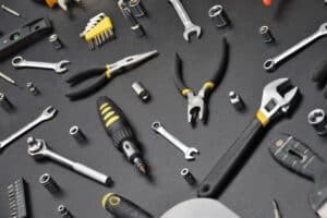 Handyman tool kit on black wooden table